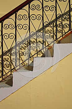 Shadow and old stairs with railing