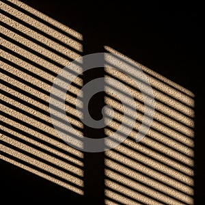 Shadow pattern on a textured surface, created by sunlight filtering