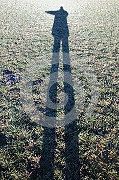 Shadow of a person on a meadow