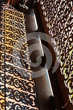shadow of sculpture of wooden bannister photo