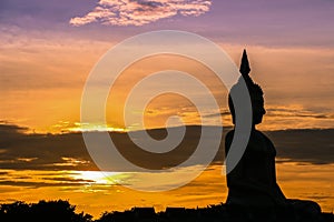 The shadow of seated buddha in evening sunset