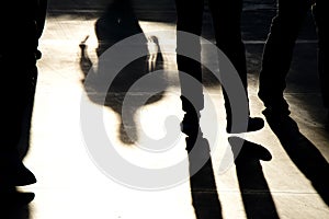 Shadow silhouettes of people walking