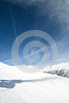 Shadow of snow gun at ski slope