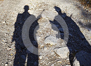 Shadow of two armed men photo