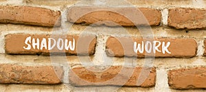 Shadow work psychology symbol. Concept words Shadow work on beautiful brown brick wall. Beautiful brown brick wall background.