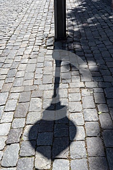 Shadowed cobbles on KÃ¤llargrÃ¤nd Stockholm