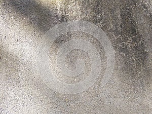 Shadows on a beige wall. Abstract background, grunge concrete texture. Minimal horizontal backdrop.