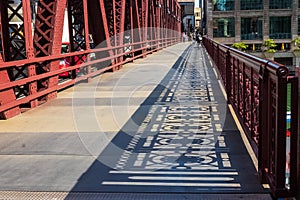 Shadows of the bridge railing design on Wells Street drawbridge in downtown Chicago Loop