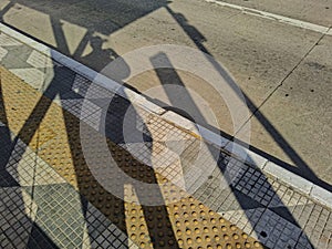 Shadows at a bus stop