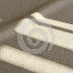 Shadows cast across a textured, beige fabric surface, creating a pattern of light and