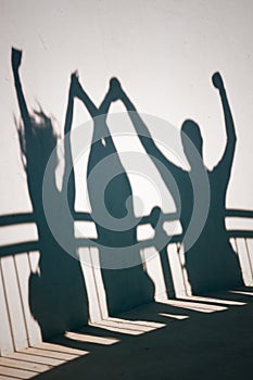 Shadows of happy people