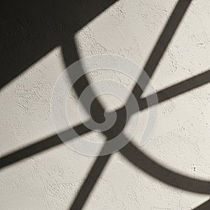 Shadows of intersecting lines create abstract patterns on a textured white surface. The