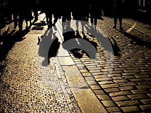 shadows on the paving stones paving the old city walk sunset friends company happy minutes romance meeting tourists