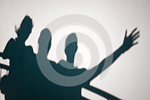 Shadows of people gesturing