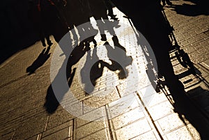 Shadows of people on street