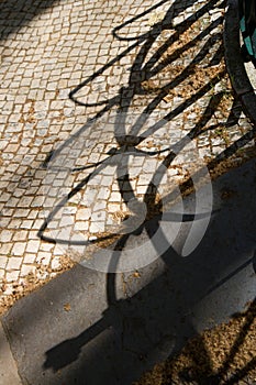 Shadows on portuguese stone calcada portuguesa photo