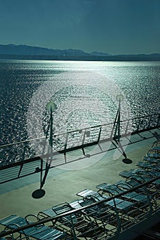 Shadows, railing & deck chair