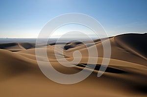 Shadows of sand dunes in desert Iran