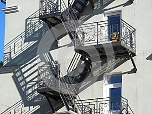 Shadows of staircases and balconies on a bright sunny day