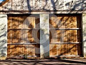 Shadows through tree branches create texture on the wooden