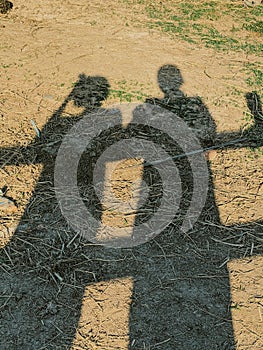 shadows of two men standing