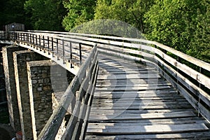 Shadows walking on a bridge