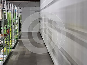 Shadows on the wall and racks in a textile museum