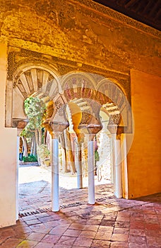 The shady corridor of Nasrid Palace, Alcazaba, Malaga, Spain