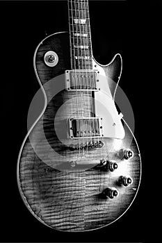 Shady Monochrome Vintage Electric Guitar - tiger maple under arty lighting showing texture and detail