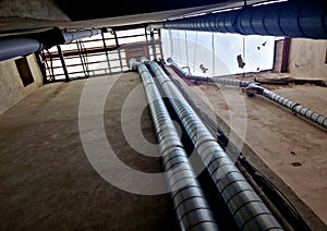 the shaft of an apartment building is a narrow atrium through which pipelines