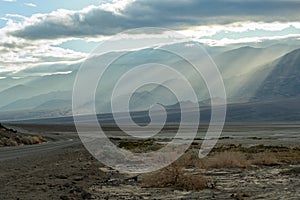 Shafts of light along Colville Ridge in Death Valley National Park, California, USA