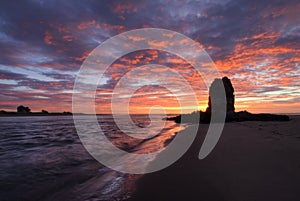 Shag rock at sunrise, Christchurch, New Zealand photo