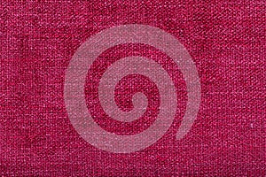 shaggy surface. fine grain felt red fabric. texture polyester close-up. dark pink fleecy background