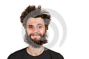 Shaggy young bearded man with long hair before haircut on a white isolated background