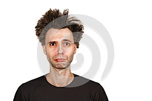 Shaggy young man with long hair before haircut on a white isolated background