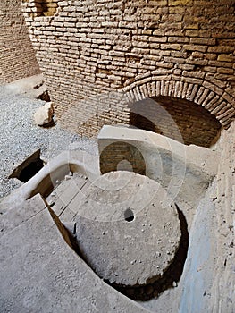 Shahdad oasis in Iran. Ancient watermill photo