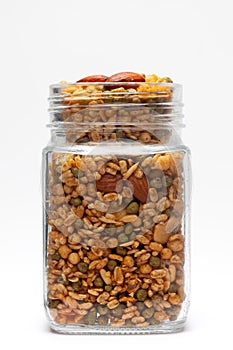 Shahi Mixture in a glass jar, made with peanut, cashew, corn flakes, almonds.