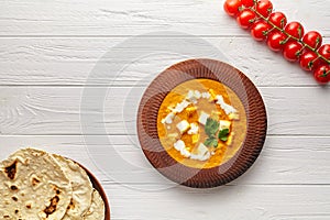 Shahi paneer traditional Indian vegetarian masala gravy with vegetables and butter paneer cheese on white background