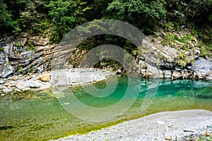 Shakadang hiking trail river view with crystal clear water and m