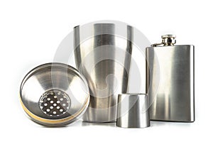 Shaker and bartending accessories on a white table. Mixing different alcohols to prepare drinks