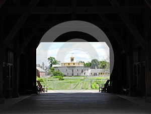 Shaker visitor center barn view towards round barn