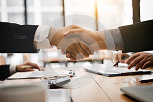 Shaking hands after agree to contracting partner for import product photo
