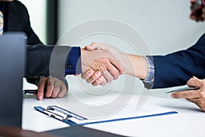 Shaking hands business people in office, business communication and marketing concept