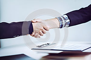 Shaking hands business people in office, business communication and marketing concept