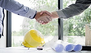 Shaking hands of collaboration, Construction engineering or arch