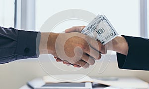 Shaking hands with congratulations on an evil plan