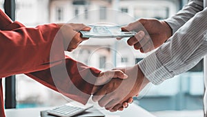 Shaking hands with congratulations on an evil plan