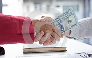 Shaking hands with congratulations on an evil plan