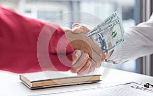 Shaking hands with congratulations on an evil plan