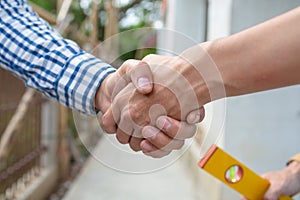 Shaking hands of foreman engineer teamwork.